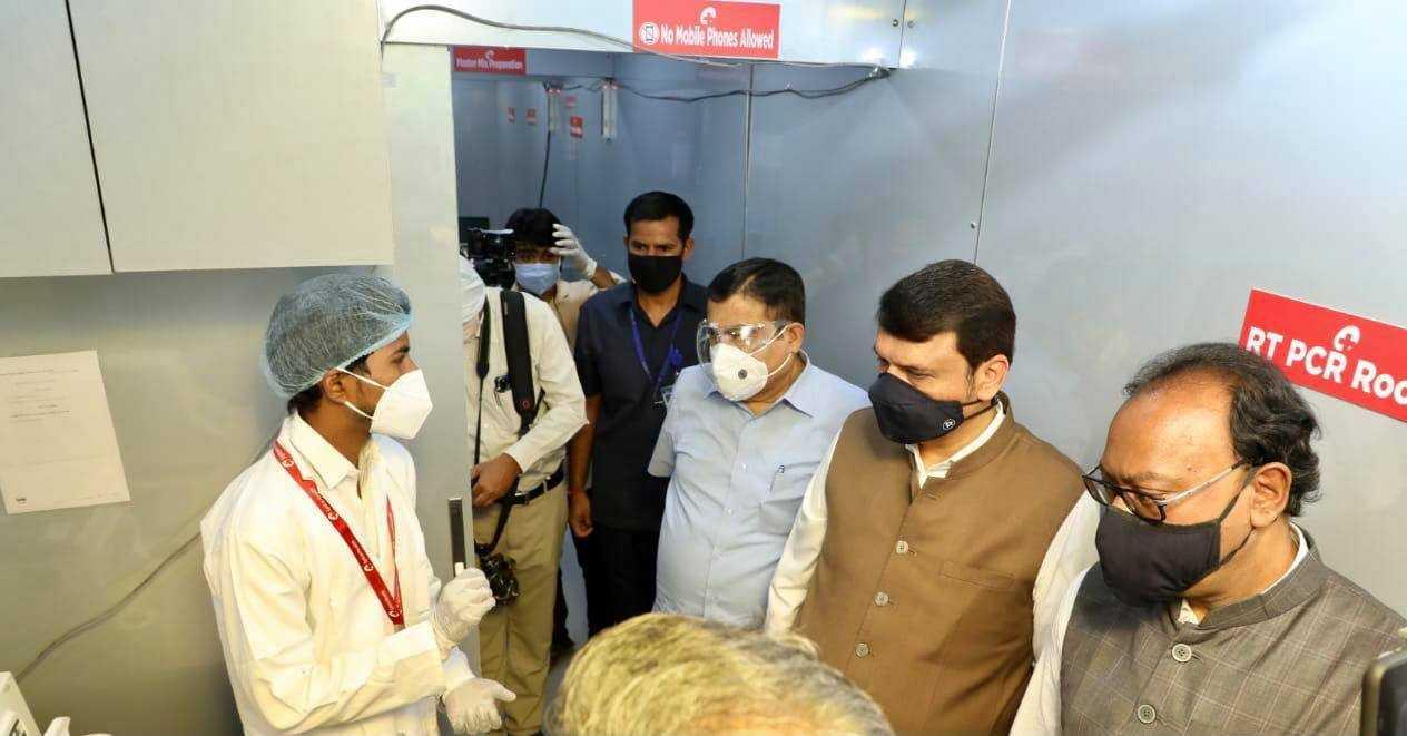 From left: Union Minister Nitin Gadkari, Leader of Opposition Devendra Fadnavis and former minister Chandrashekhar Bawankule inside the Spice Health mobile RT-PCR testing lab in Nagpur 